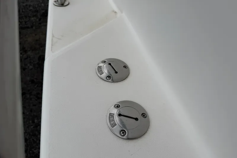 Slide: The Image of Fuel caps on a 2004 Pro Sports 2660 WA ProKat boat deck. - 27
