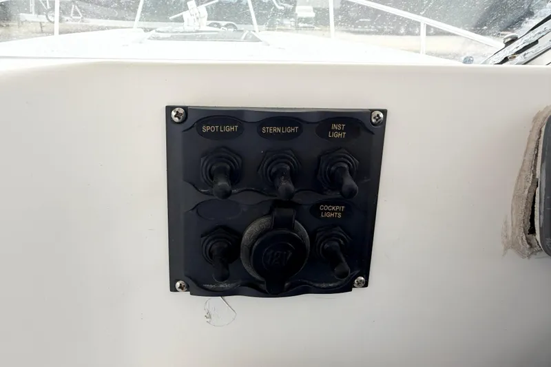 Slide: The Image of Control panel on 2004 Pro Sports 2660 WA ProKat boat with labeled switches. - 29