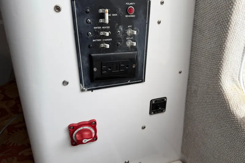 Slide: The Image of Control panel of a 2004 Pro Sports 2660 WA ProKat boat, featuring switches and dials. - 36