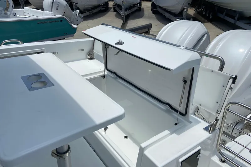 Slide: The Image of 2026 Jeanneau Leader 9.0 WA Series 2 boat deck with open storage compartment. - 10