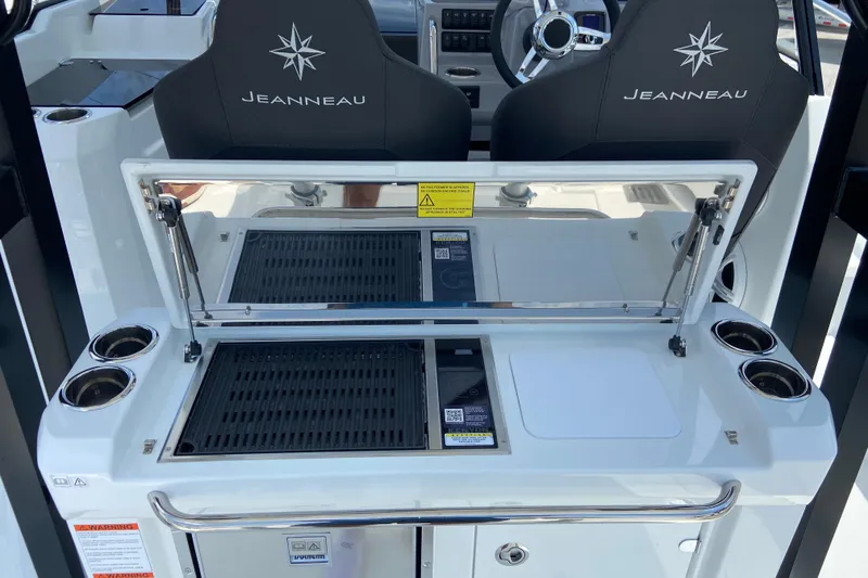 Slide: The Image of 2026 Jeanneau Leader 9.0 WA Series 2 boat cockpit with grill and steering wheel. - 12