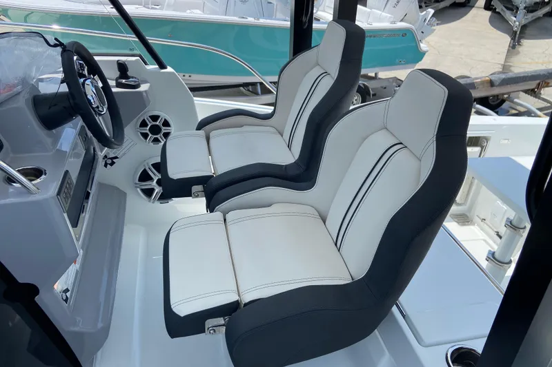 Slide: The Image of Interior of 2026 Jeanneau Leader 9.0 WA Series 2, featuring modern dual seats and steering console. - 17