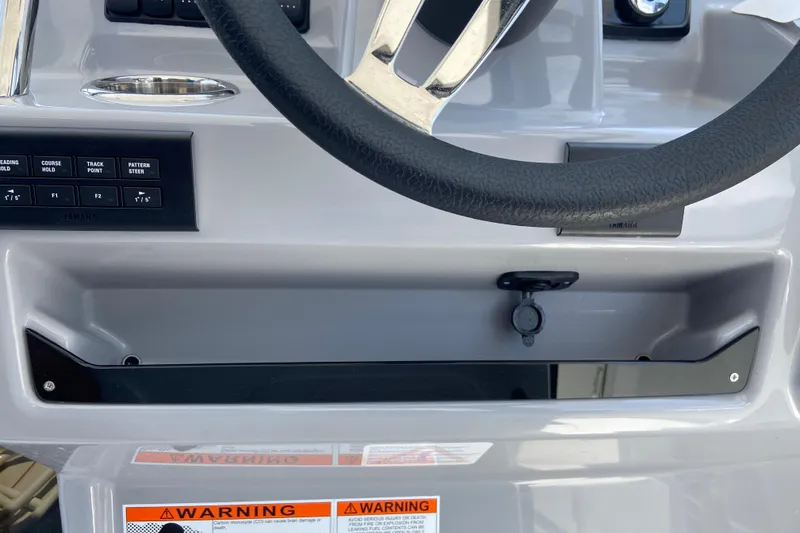 Slide: The Image of Control panel of 2026 Jeanneau Leader 9.0 WA Series 2 boat with steering wheel. - 25