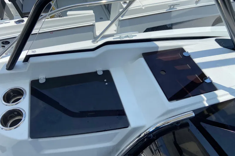 Slide: The Image of 2026 Jeanneau Leader 9.0 WA Series 2 boat deck with cup holders and storage compartments. - 27