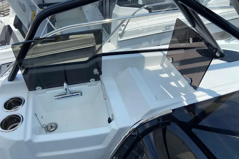 Slide: The Image of 2026 Jeanneau Leader 9.0 WA Series 2 boat cockpit with sink and cup holders. - 28