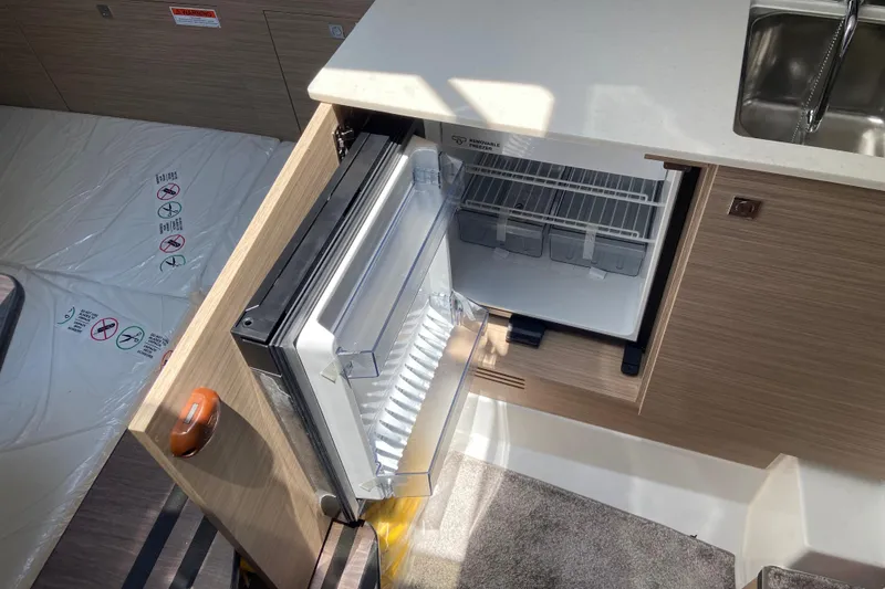 Slide: The Image of Compact kitchen area in 2026 Jeanneau Leader 9.0 WA Series 2 boat. - 33