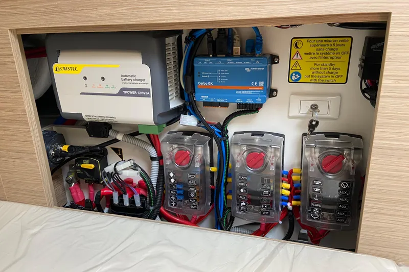 Slide: The Image of Electrical panel of 2026 Jeanneau Leader 9.0 WA Series 2 with battery charger and switches. - 40