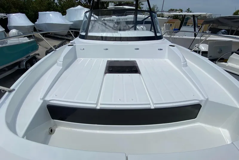 Slide: The Image of 2026 Jeanneau Leader 9.0 WA Series 2 boat, sleek white deck, docked outdoors. - 47