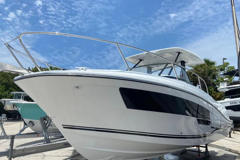 Slide: The Image of 2026 Jeanneau Leader 9.0 WA Series 2 boat on display under a clear blue sky. - 49