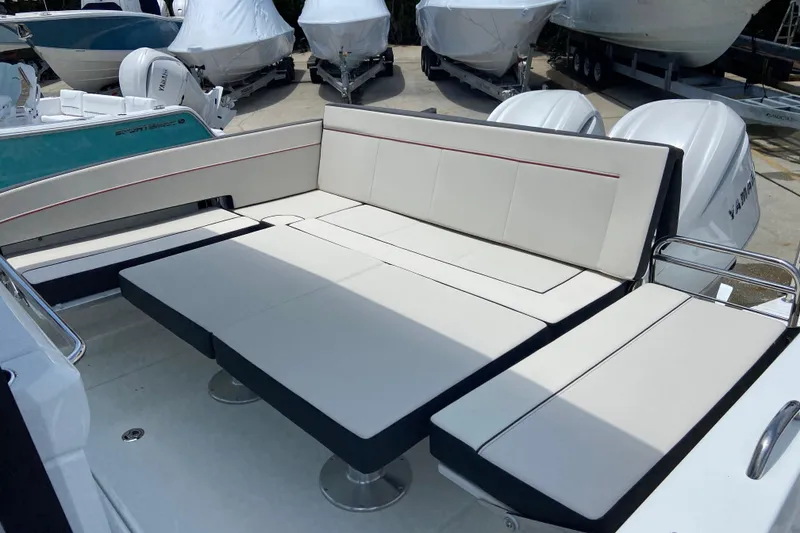 Slide: The Image of 2026 Jeanneau Leader 9.0 WA Series 2 boat with spacious seating and dual outboard engines. - 5