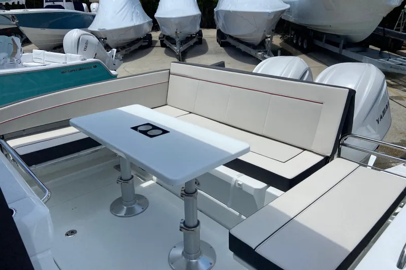 Slide: The Image of 2026 Jeanneau Leader 9.0 WA Series 2 boat interior with seating and table. - 6