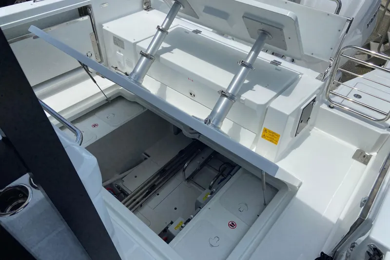 Slide: The Image of 2026 Jeanneau Leader 9.0 WA Series 2 boat interior with open storage compartments. - 9