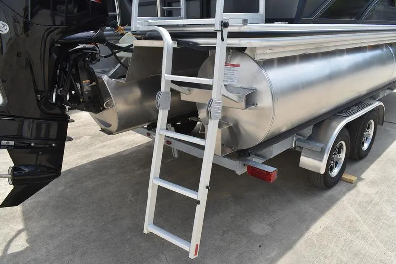 Slide: The Image of Rear view of 2026 Lowe SS 230 WT Special pontoon boat with ladder and trailer. - 11