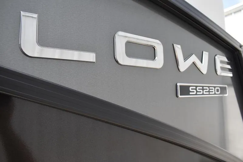 Slide: The Image of 2026 Lowe SS 230 WT Special boat logo on sleek black surface. - 14
