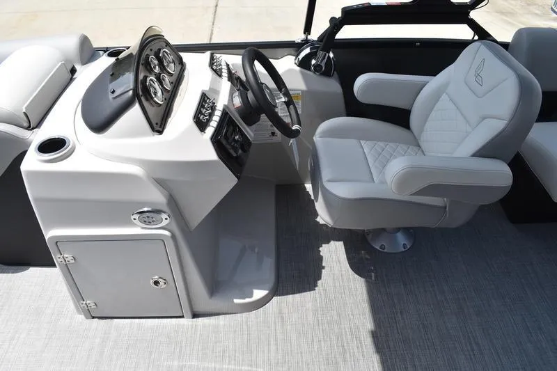 Slide: The Image of 2026 Lowe SS 230 WT Special boat interior with steering console and cushioned captain's chair. - 24
