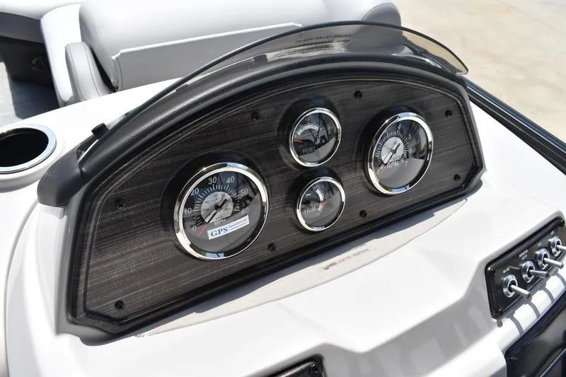 Slide: The Image of Dashboard of 2026 Lowe SS 230 WT Special boat with gauges and controls. - 26