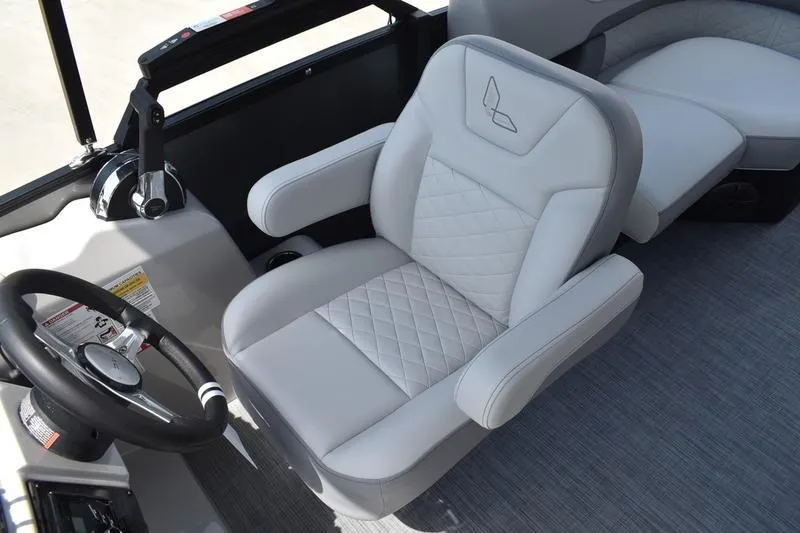 Slide: The Image of Captain's chair in 2026 Lowe SS 230 WT Special boat, featuring luxurious white upholstery. - 31