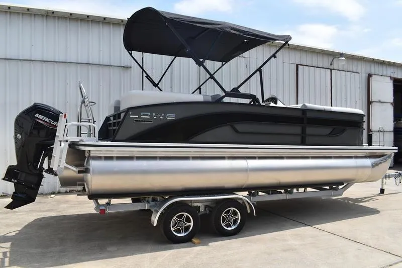 Slide: The Image of 2026 Lowe SS 230 WT Special pontoon boat with canopy on trailer. - 4