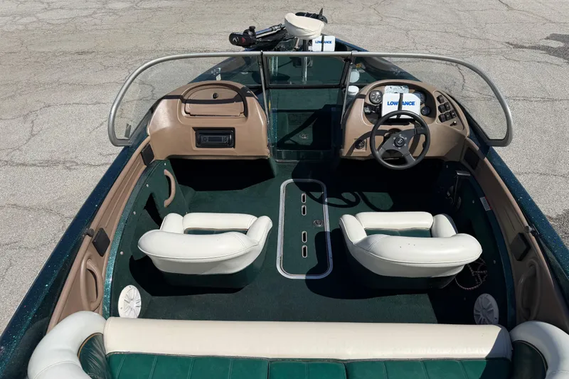 Slide: The Image of Interior of a 1998 Ranger R97 boat with seating and steering console. - 2