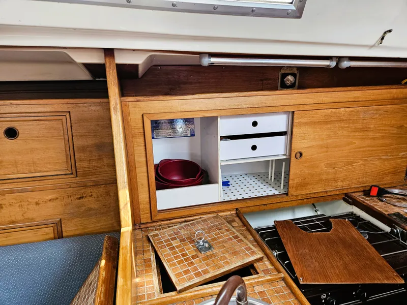 Slide: The Image of Interior of a 1984 Wauquiez Pretorien yacht with wooden cabinetry. - 33