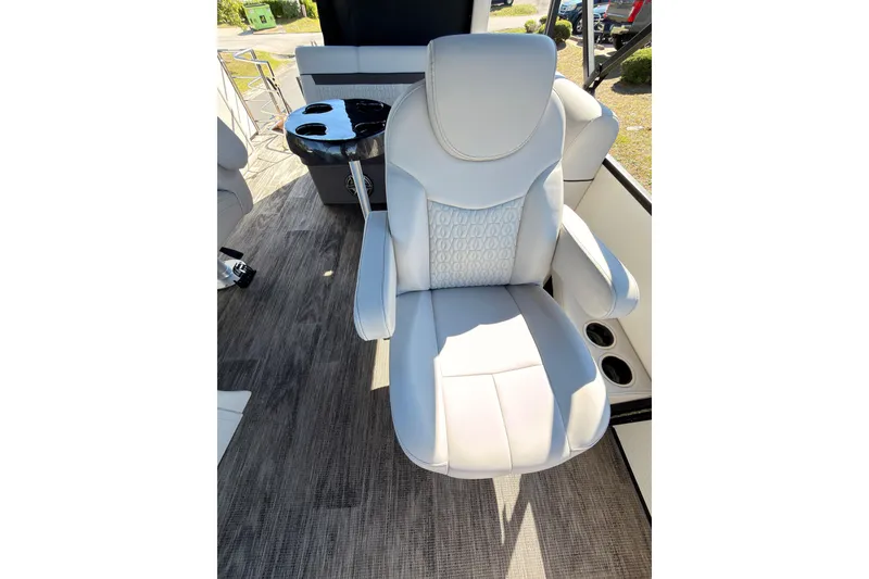 Slide: The Image of Luxurious white captain's chair on a 2021 Godfrey 2286 boat, featuring elegant design and comfort. - 14