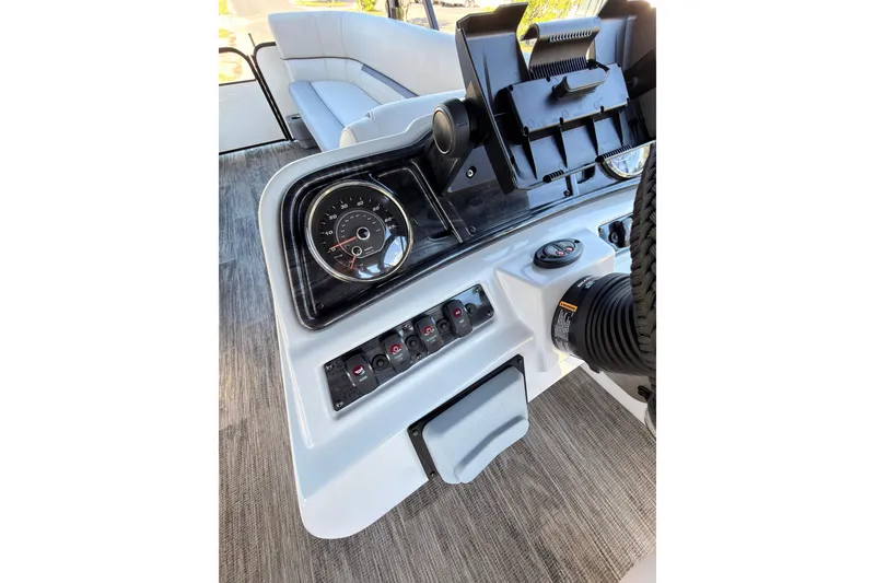 Slide: The Image of Dashboard of a 2021 Godfrey 2286 boat with gauges and controls. - 20