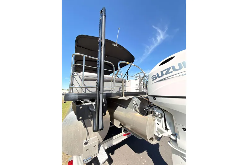 Slide: The Image of 2021 Godfrey 2286 boat with Suzuki engine, rear view under clear blue sky. - 23