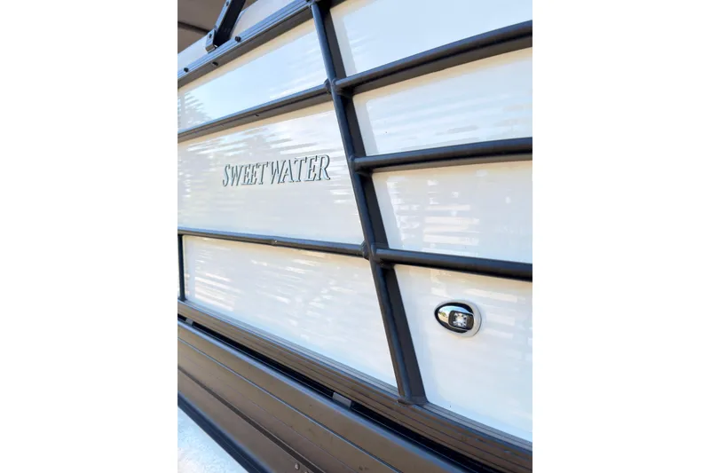 Slide: The Image of Close-up of 2021 Godfrey Sweetwater 2286 boat exterior with sleek design details. - 25