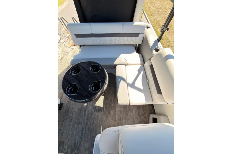 Slide: The Image of Luxurious seating area on a 2021 Godfrey 2286 boat with cup holders and stylish upholstery. - 4