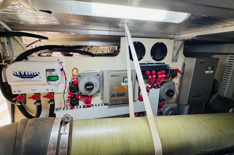 Slide: The Image of Engine room of 2006 Carver 46 Voyager with Reverso oil change system and electrical components. - 103
