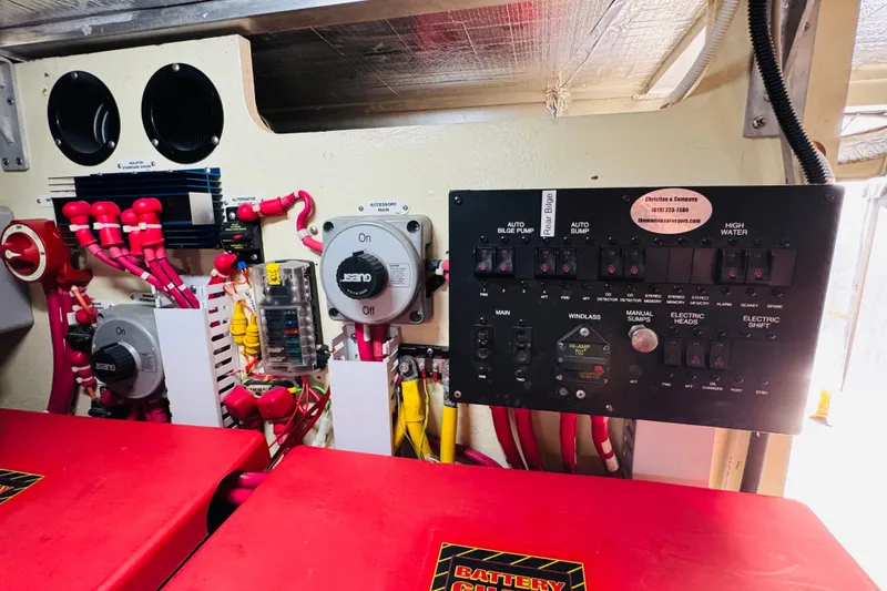 Slide: The Image of Electrical panel and wiring inside a 2006 Carver 46 Voyager boat. - 105