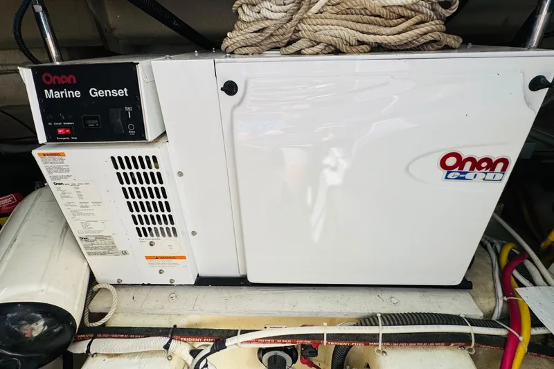 Slide: The Image of Onan marine generator in a 2006 Carver 46 Voyager yacht engine room. - 106