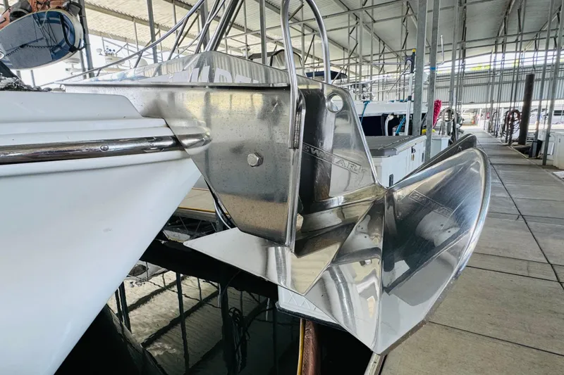 Slide: The Image of 2006 Carver 46 Voyager yacht with stainless steel anchor in marina. - 17
