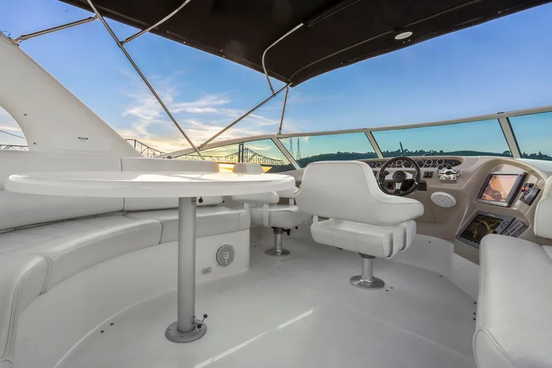Slide: The Image of Luxurious 2006 Carver 46 Voyager yacht interior with helm and seating area. - 26