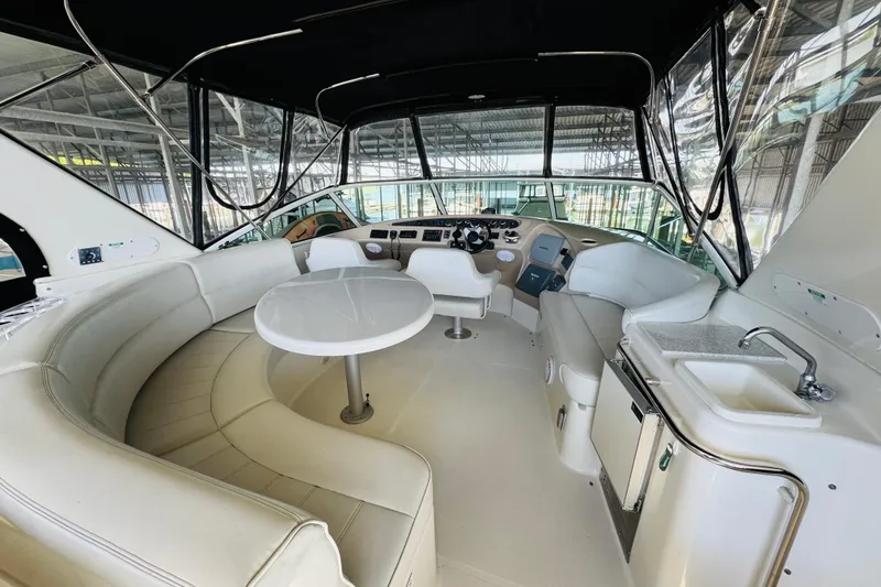 Slide: The Image of Luxurious interior of a 2006 Carver 46 Voyager yacht with seating and kitchenette. - 27