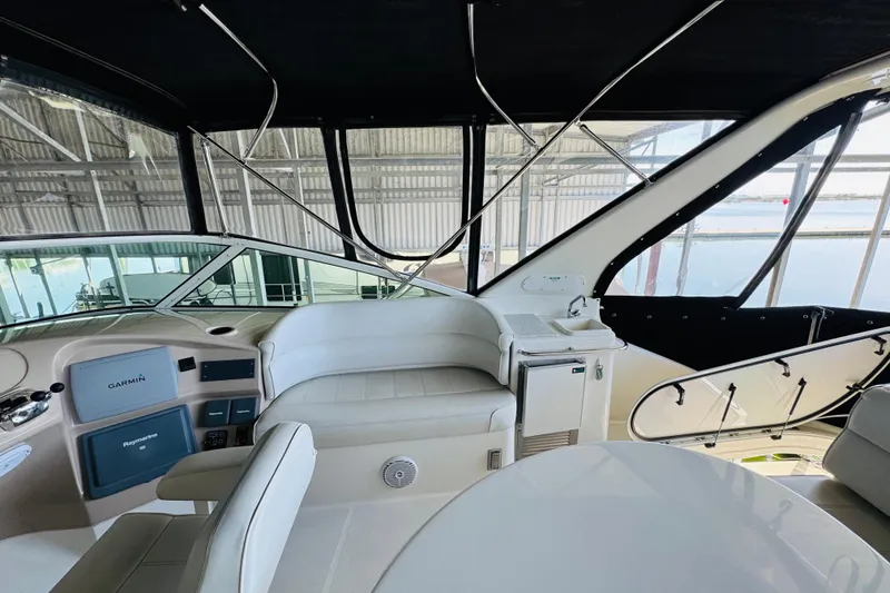 Slide: The Image of Interior of 2006 Carver 46 Voyager yacht with helm and seating area. - 32