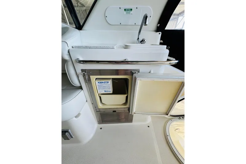 Slide: The Image of 2006 Carver 46 Voyager yacht interior with sink and ice maker. - 35