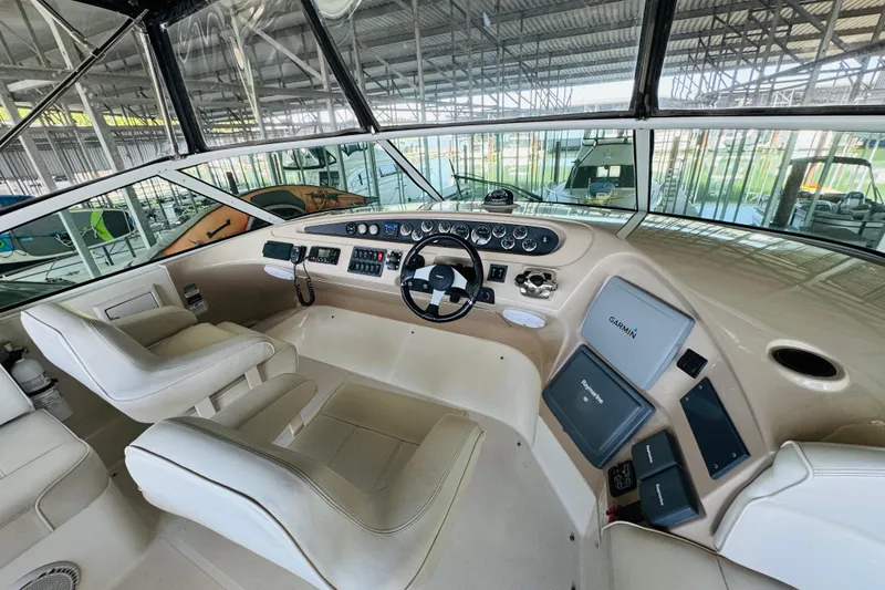 Slide: The Image of Interior of 2006 Carver 46 Voyager yacht with modern navigation equipment and plush seating. - 36