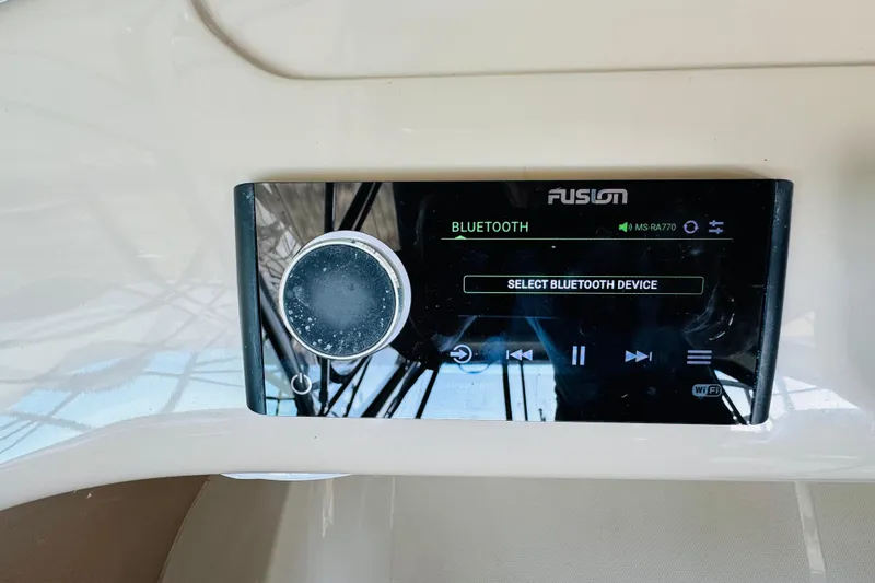 Slide: The Image of Fusion Bluetooth stereo system on a 2006 Carver 46 Voyager yacht dashboard. - 41