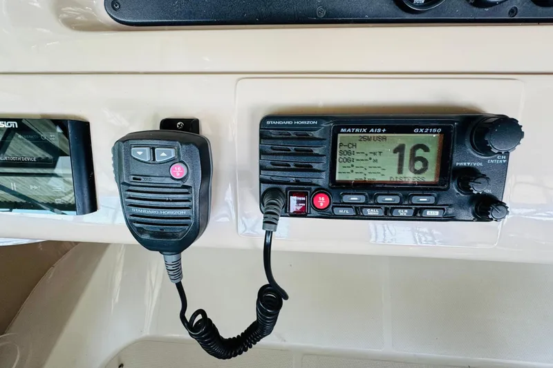 Slide: The Image of Standard Horizon radio equipment on 2006 Carver 46 Voyager yacht dashboard. - 42