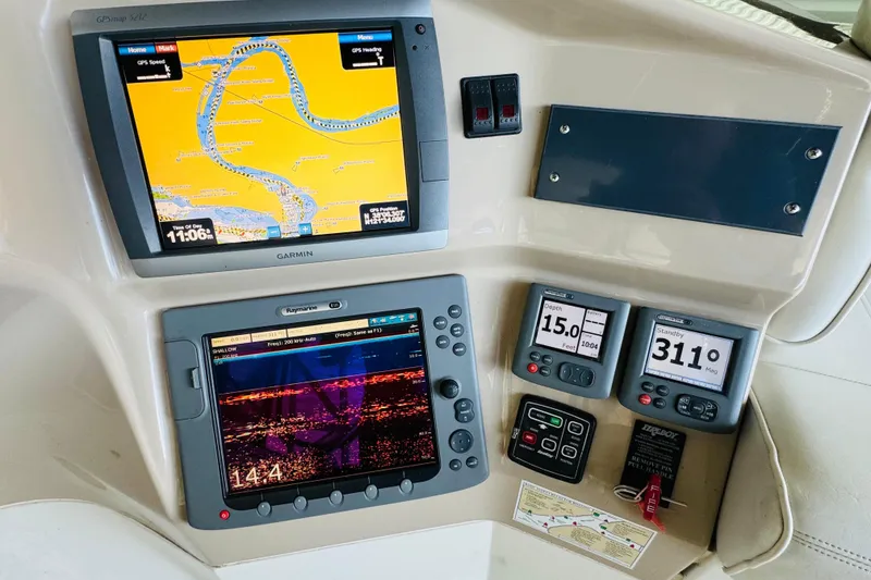 Slide: The Image of Navigation and control panel of a 2006 Carver 46 Voyager yacht. - 43