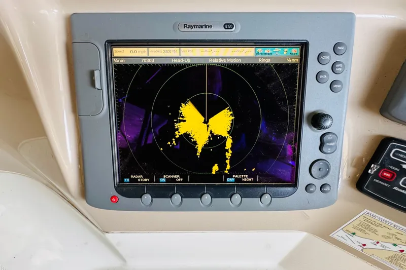 Slide: The Image of Radar display on 2006 Carver 46 Voyager yacht, showing navigation data and controls. - 44