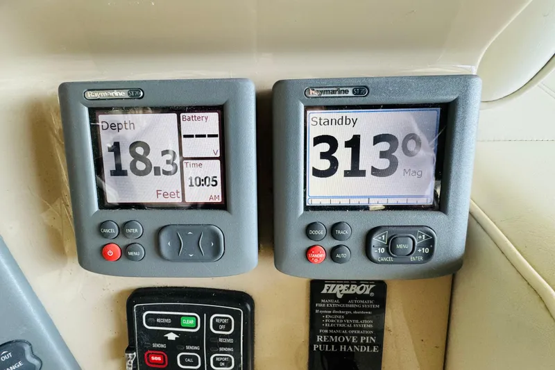Slide: The Image of Raymarine ST70 displays on 2006 Carver 46 Voyager, showing depth and compass heading. - 46