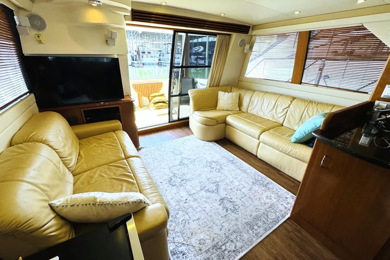 Slide: The Image of Luxurious interior of 2006 Carver 46 Voyager yacht with leather seating and large windows. - 54