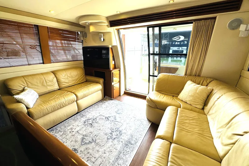 Slide: The Image of Luxurious interior of 2006 Carver 46 Voyager yacht with leather sofas and elegant decor. - 55