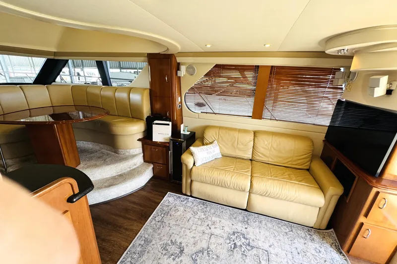 Slide: The Image of Luxurious interior of 2006 Carver 46 Voyager yacht with leather seating and elegant wood finishes. - 57