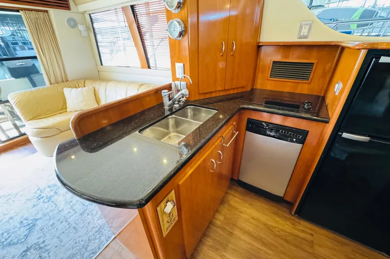 Slide: The Image of Luxurious kitchen interior of 2006 Carver 46 Voyager yacht with modern amenities. - 60