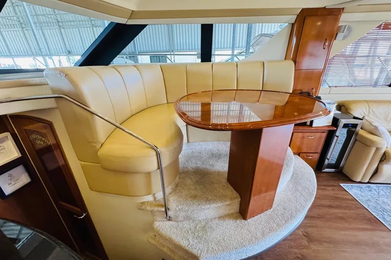 Slide: The Image of Luxurious interior of 2006 Carver 46 Voyager yacht with elegant seating and wooden table. - 69