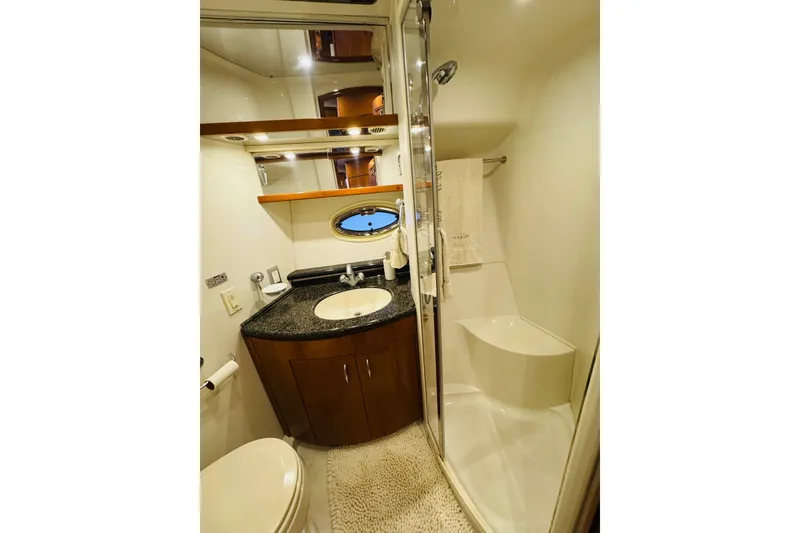 Slide: The Image of Luxurious bathroom in 2006 Carver 46 Voyager yacht with modern fixtures and elegant design. - 80