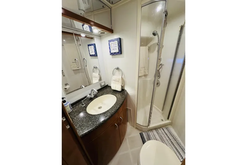Slide: The Image of Luxurious bathroom in 2006 Carver 46 Voyager yacht with modern fixtures and elegant design. - 86